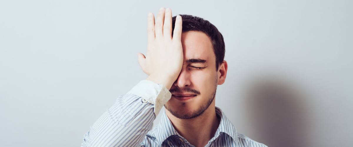 of young man thinking daydreaming worried deeply about something, uh oh made a mistake. Negative emotion facial expression feeling