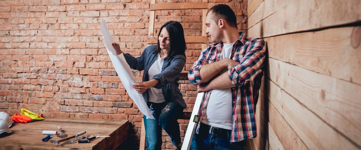 couple making repairs to their home