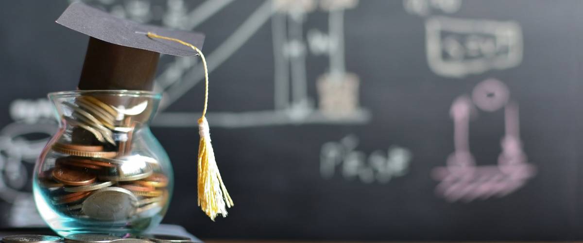 hat graduation model on coins saving for concept investment education and scholarships