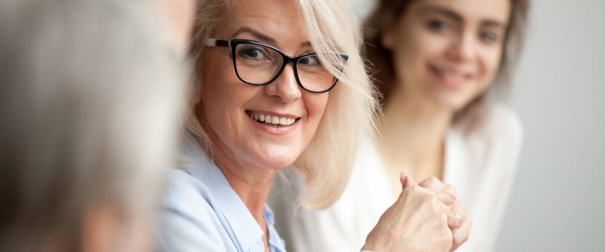 smiling old woman working as company worker