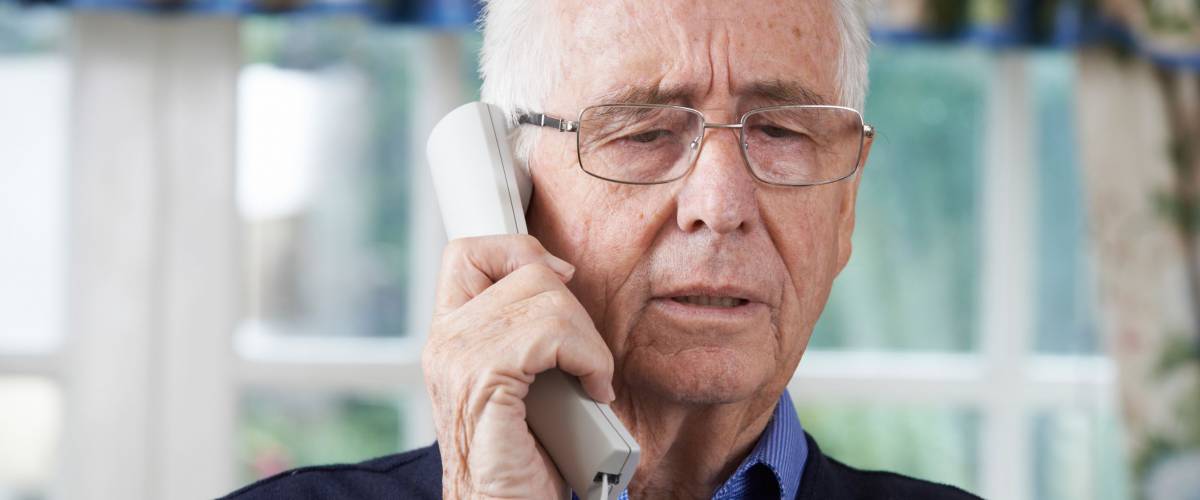 Senior Man Giving Credit Card Details On The Phone
