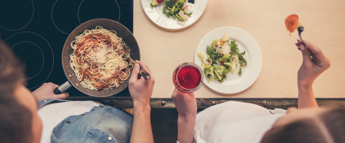 Couple cooking together in their kitchen