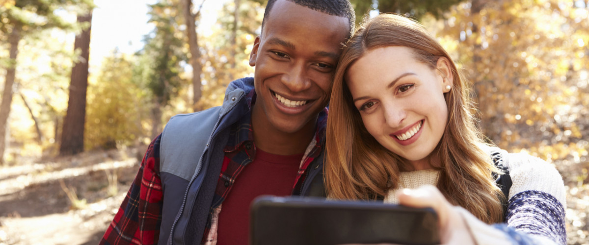 Couple hiking and taking a selfie
