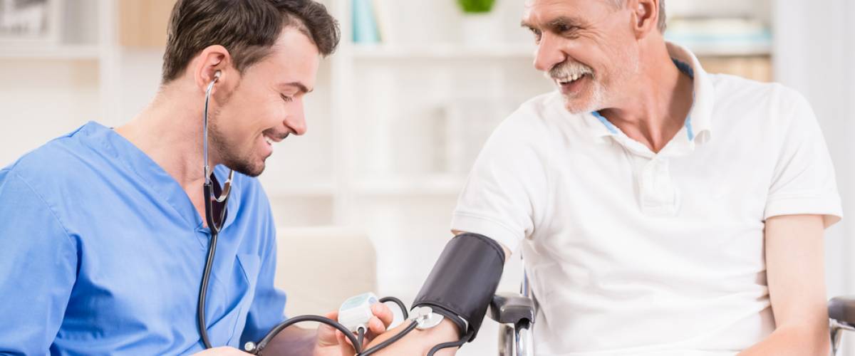 nurse taking patient's vital signs