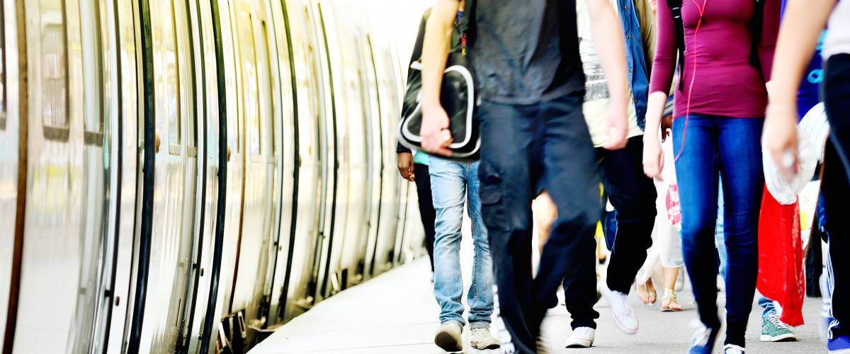 Passengers coming off a commuter train