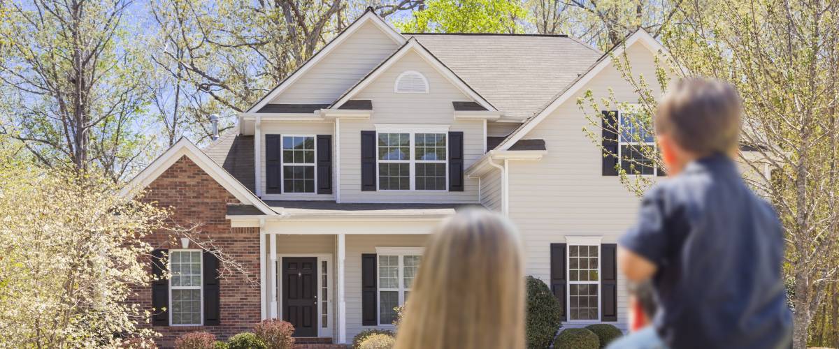 Family in front of their home