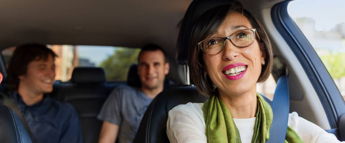 An Uber driver with passengers