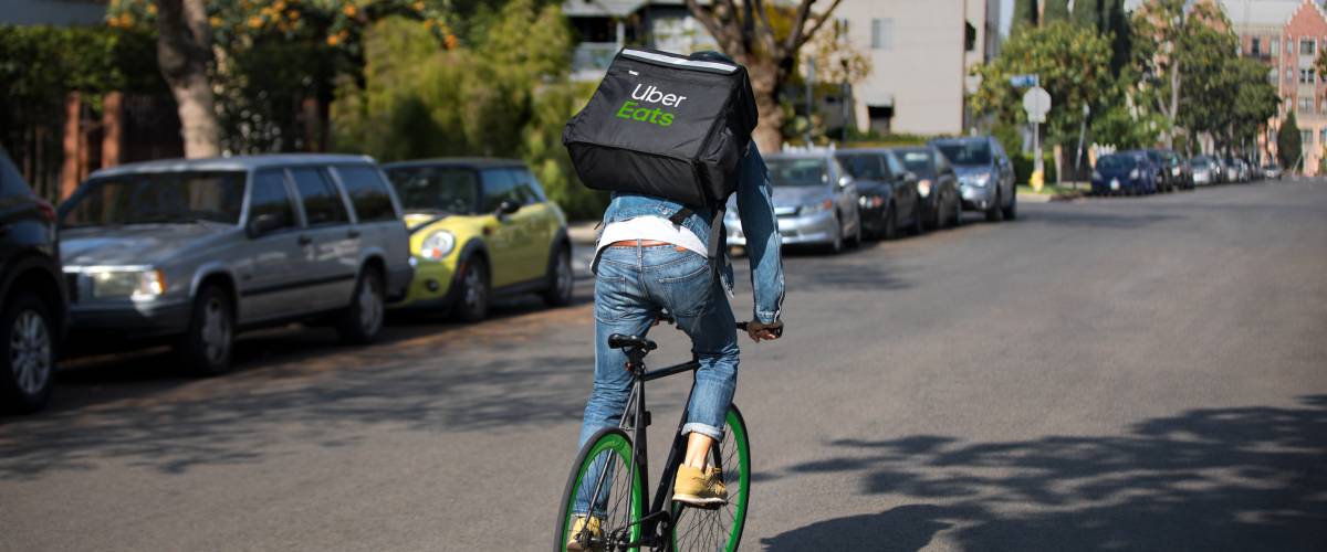An Uber Eats deliverer taking food by bicycle