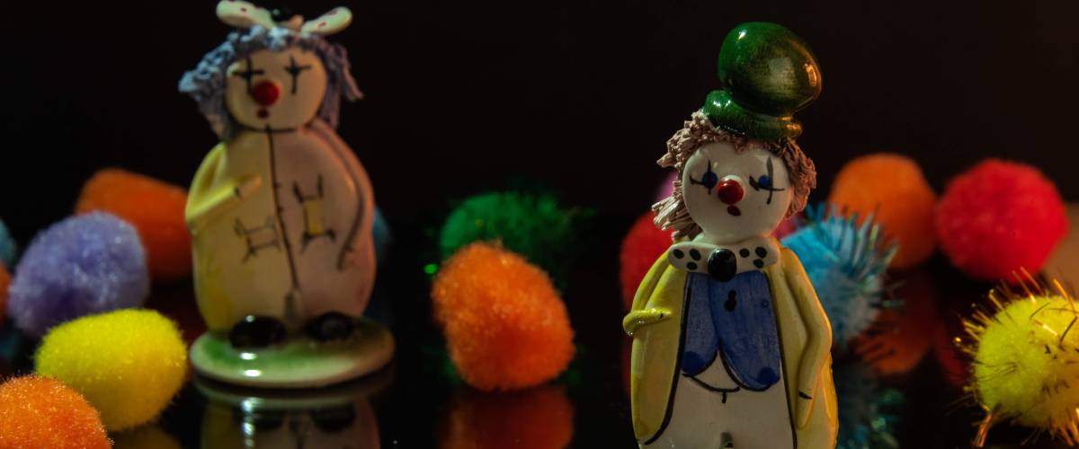Clown figurines with colorful pompoms