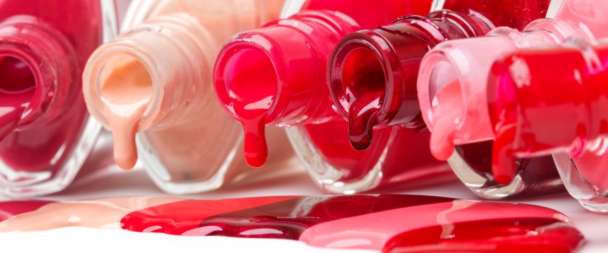 Bottles of nail polish spilling