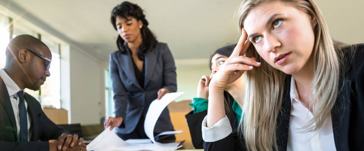 Bored aloof corporate female business executive, looking passionless, unexcited and unprofessional.