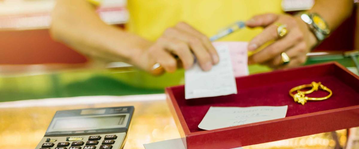 The pawn shop will give you a ticket and explain the interest rate and fee