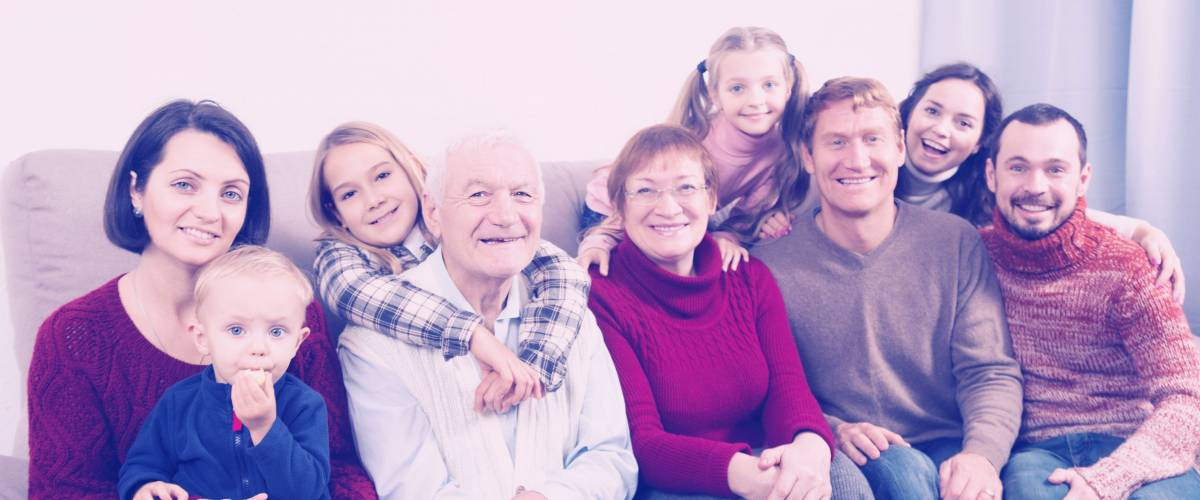 Ordinary family making numerous photos during family dinner. Focus on elderly man