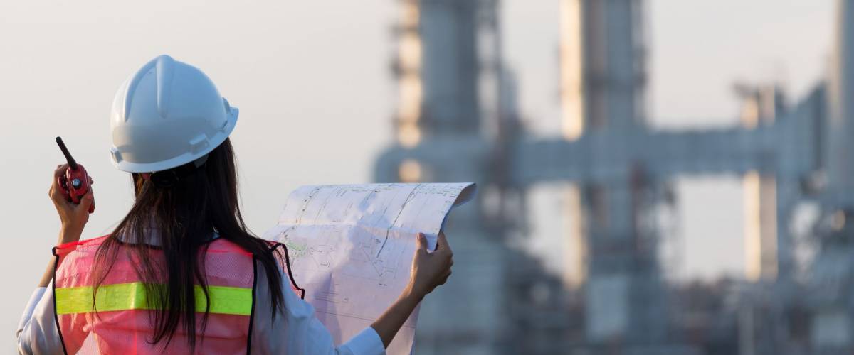 Asian women worker and engineer electrician work safety control at power plant energy industry , Thailand. Engineer Concept.