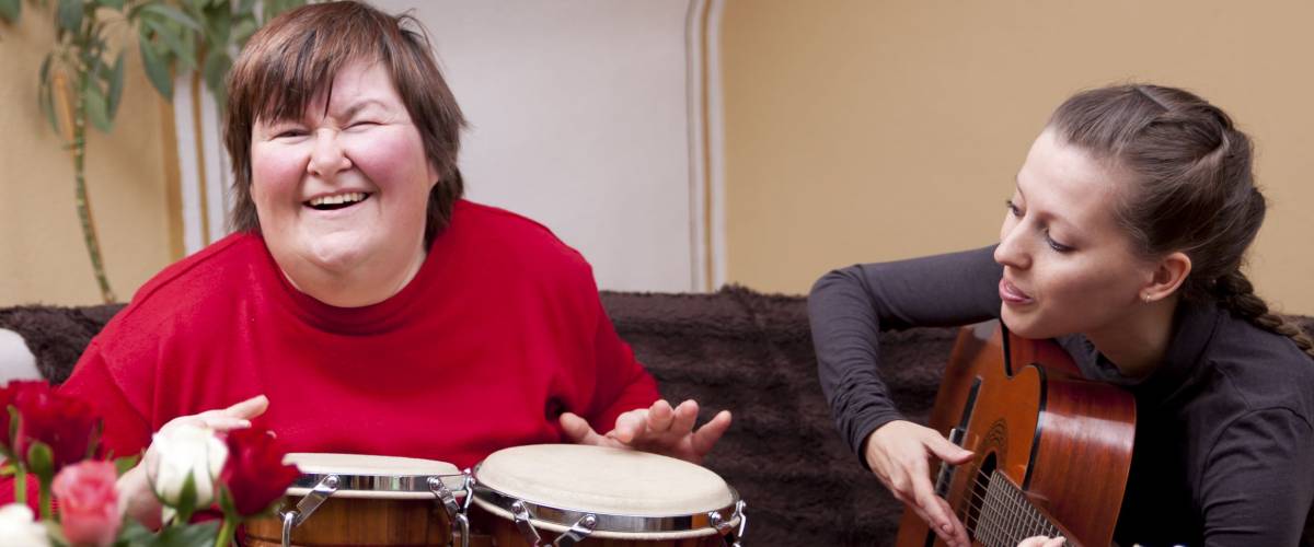 Two women make a music therapy and having fun