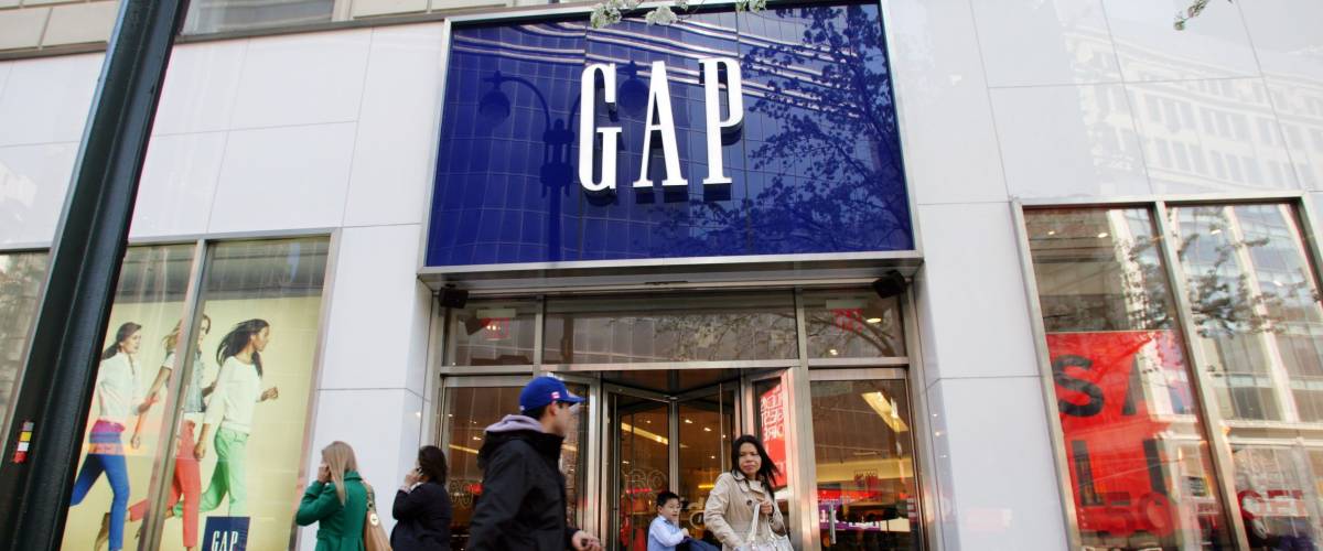NEW YORK CITY - APRIL 19: Shoppers walk past a Gap retail outlet in New York City, on Friday, April 19, 2013.