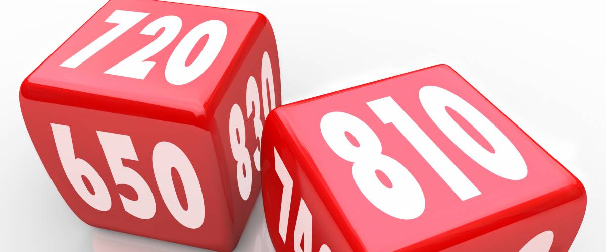 Two red dice with numbers representing credit scores