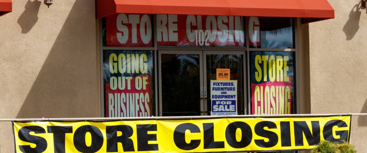Store Closing and Going out of Business signs displayed at a soon to be closed store