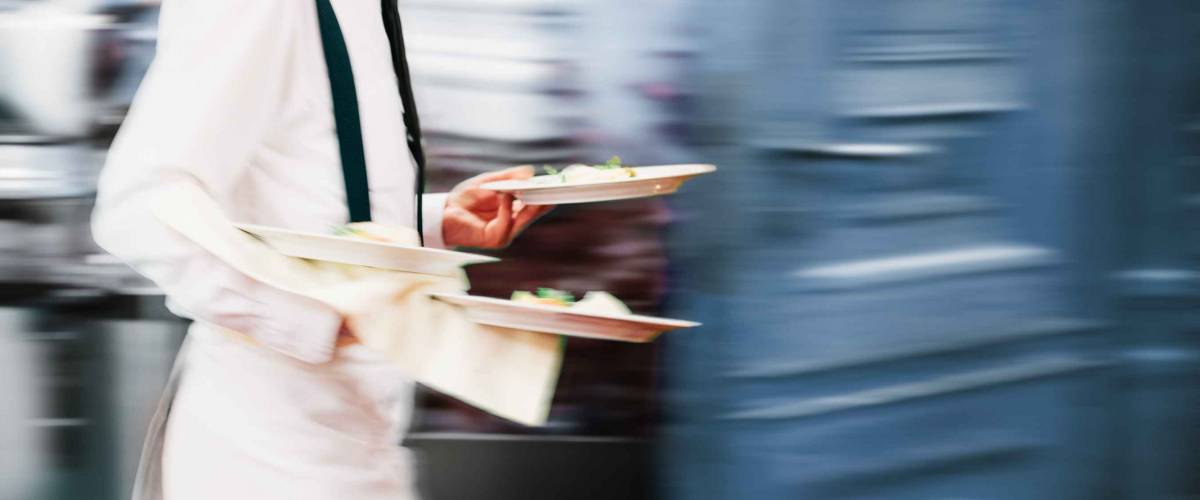 Waiter Serving In Motion On Duty in Restaurant Long Exposure | Copyspace