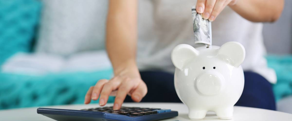 Money into piggy bank