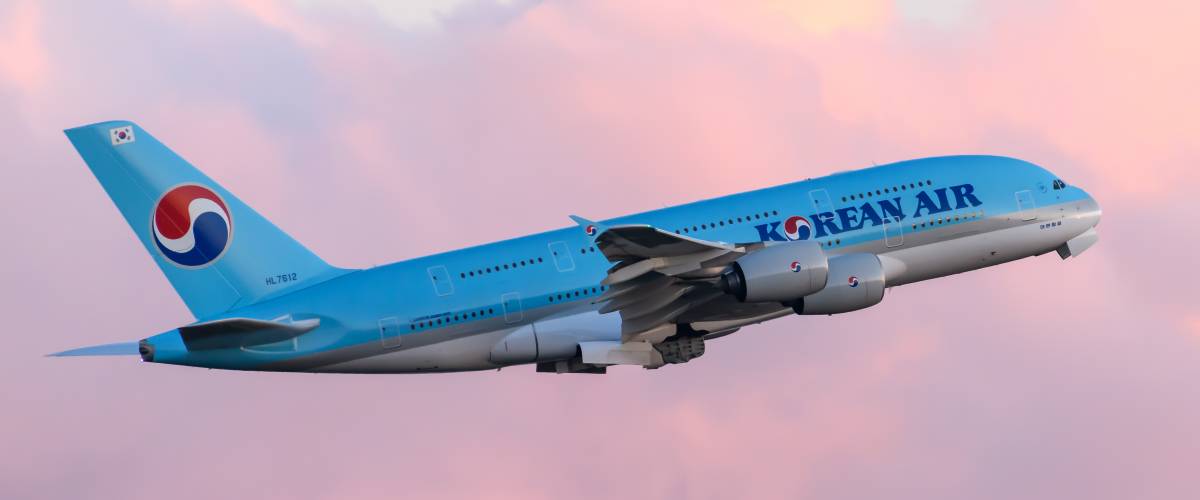 Korean Air airplane flying in the air.