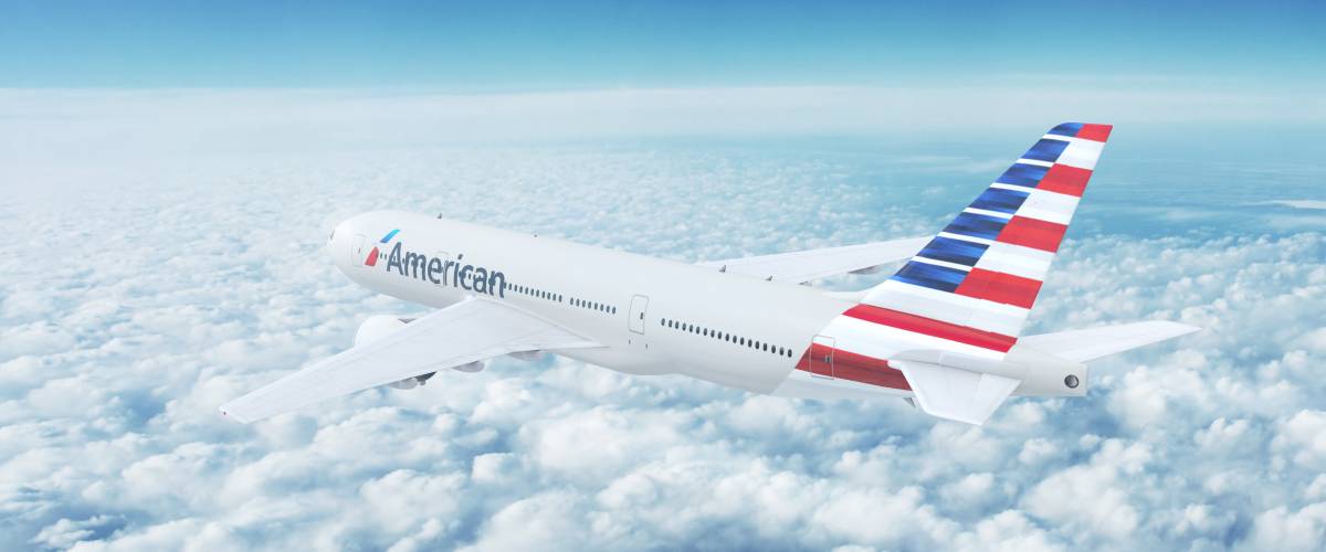 American Airlines plane flying in air.
