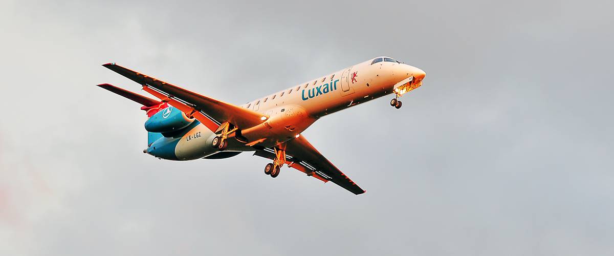 Luxair airplane flying in the air.