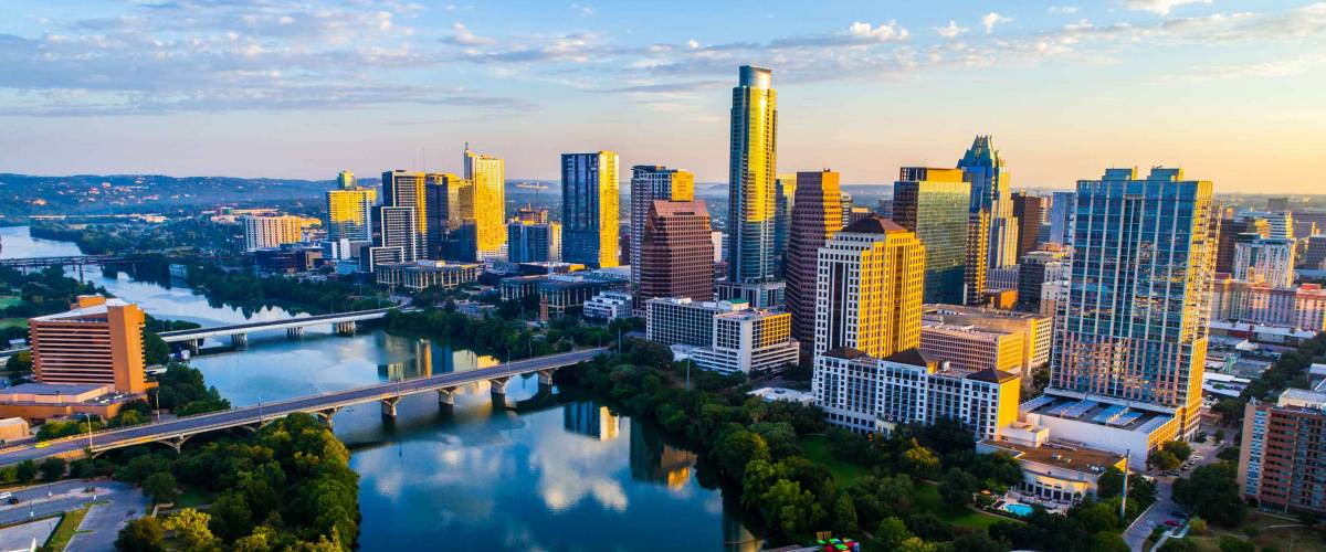 Austin Texas USA sunrise skyline cityscape over Town Lake or Lady Bird Lake with amazing reflection.