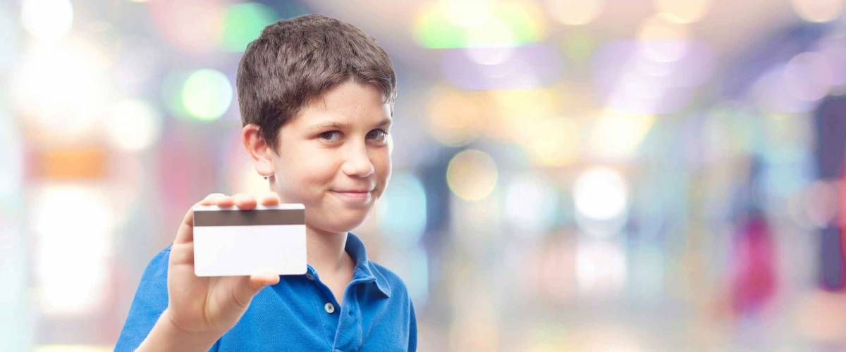 boy with credit card in the shopping center