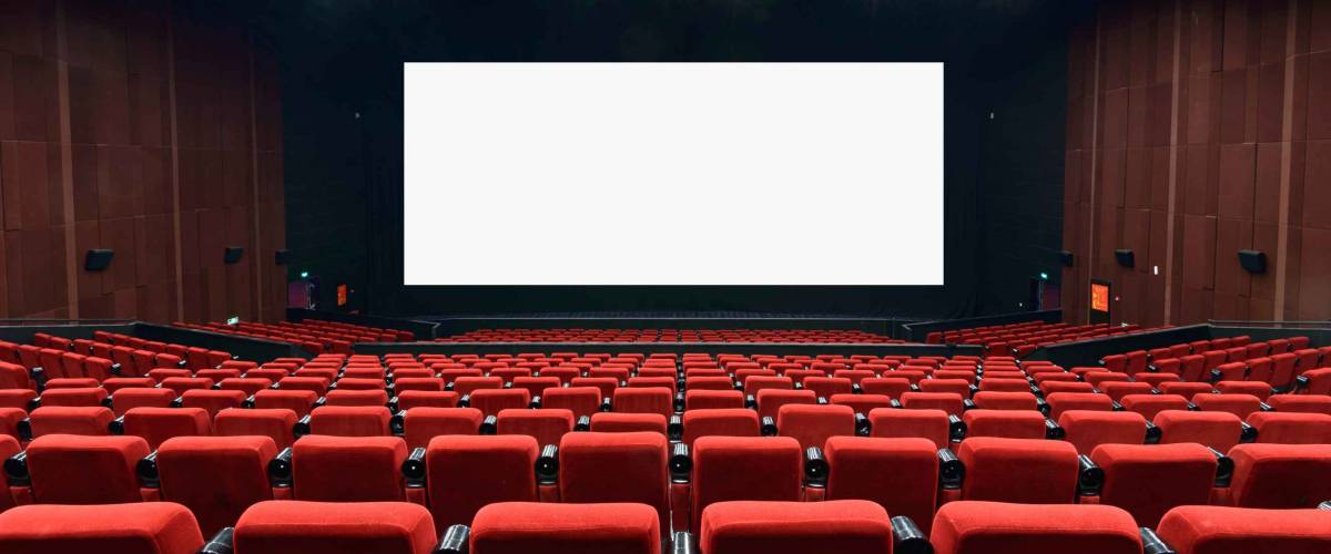 Empty movie theater with red seats