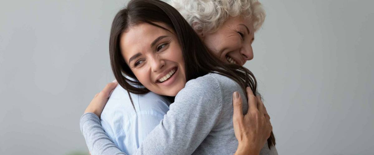 Two women hug