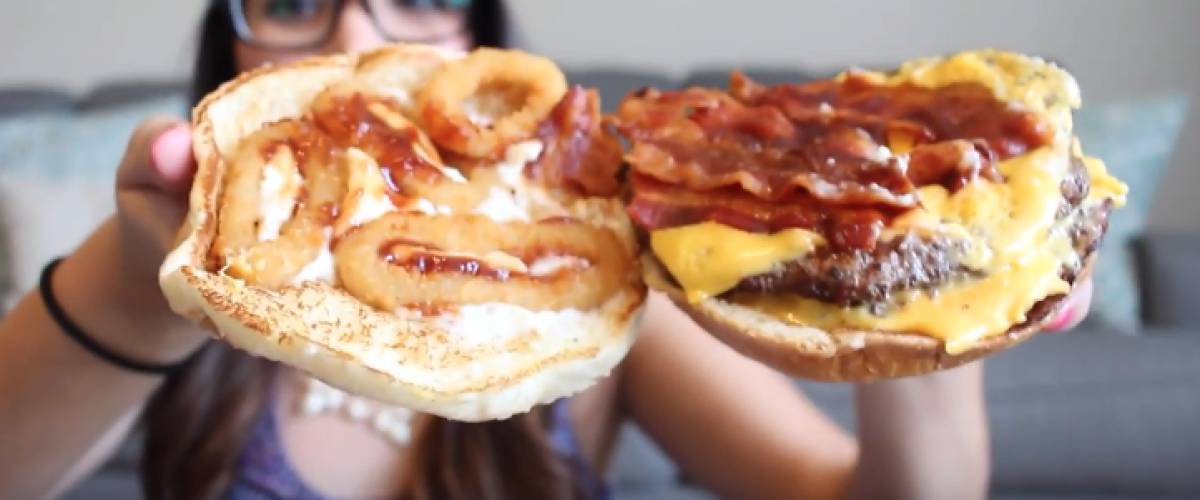 Burger with onion rings on it