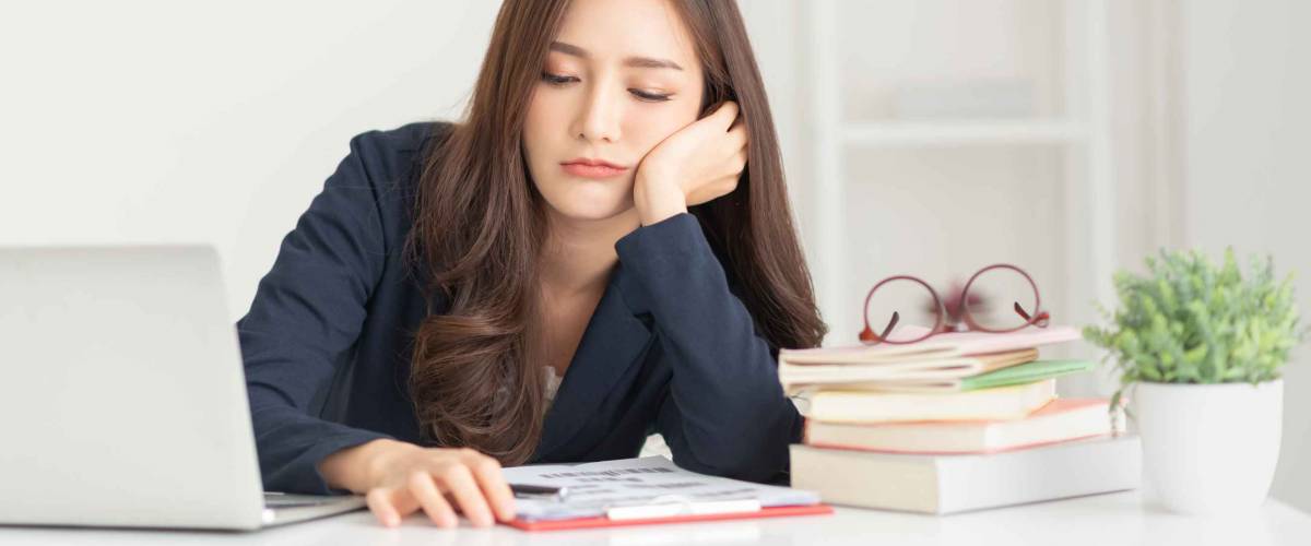 Young girl employee having problems about her financials.