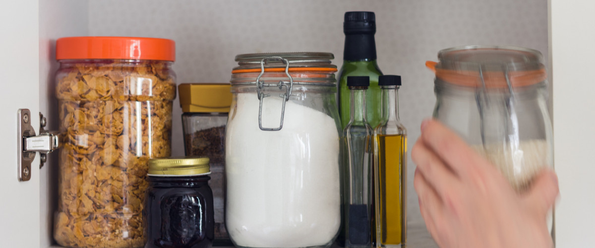 Kitchen pantry with food in jars and bottles