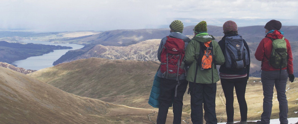 Group of hikers looking over a valley
